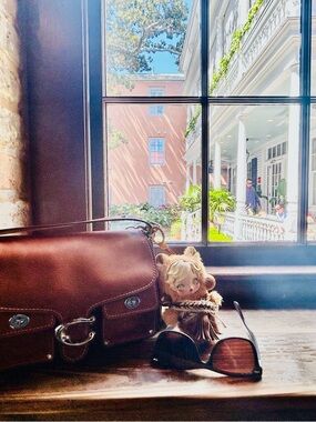 Brown Leather Crossbody Bag with Sunglasses and Doll Charm